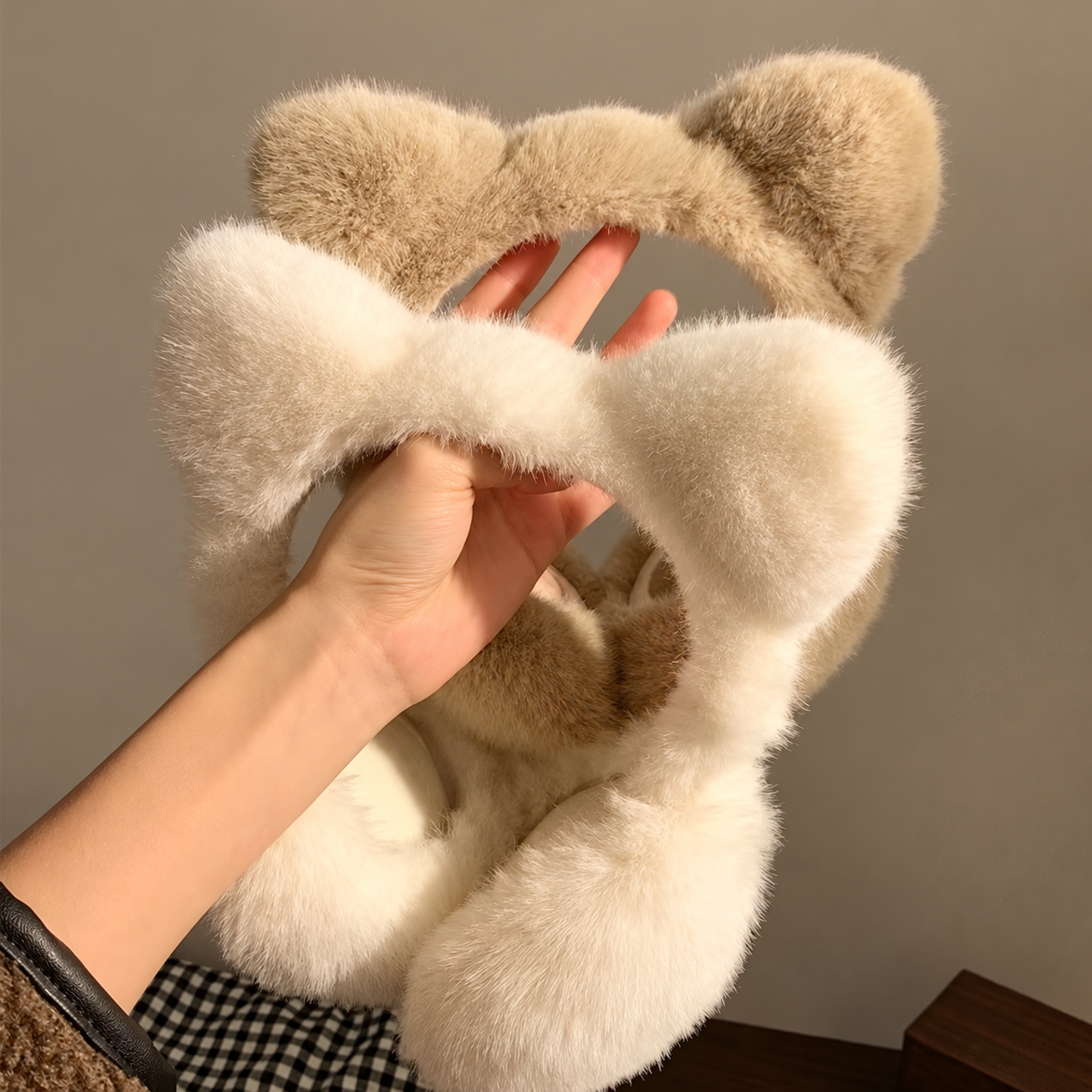 Cat-ear earmuffs shown extended and folded